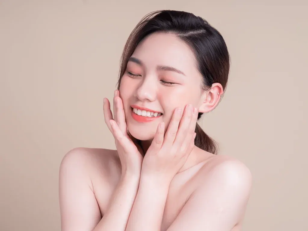 Woman touching her cheeks